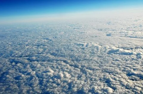 Sky and clouds Through Flight Window Stock Photos