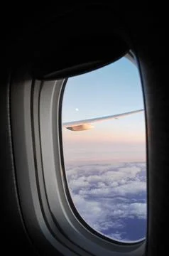 Sky and clouds Through Flight Window Stock Photos