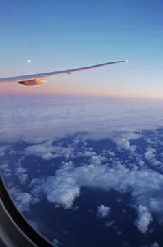 Sky and clouds Through Flight Window Stock Photos