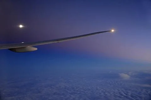 Sky and clouds Through Flight Window Stock Photos