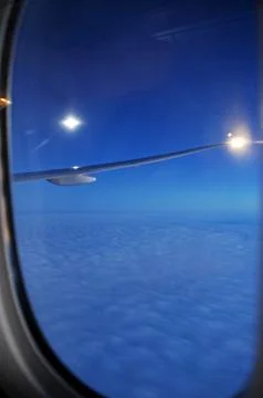Sky and clouds Through Flight Window Stock Photos