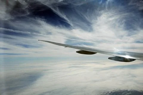 Sky and clouds Through Flight Window Stock Photos