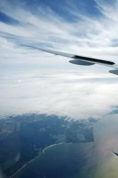 Sky and clouds Through Flight Window Stock Photos