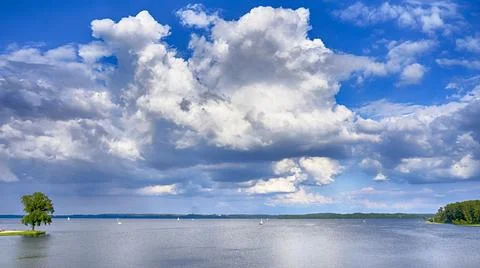 Sky and clouds with tree, the river background. Schwerin Stock Photos