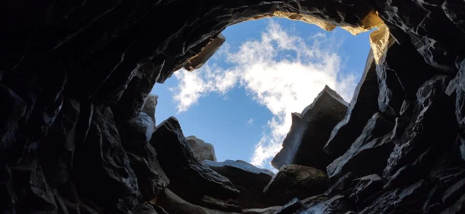 Sky and clouds view from within a stone well Stock Photos