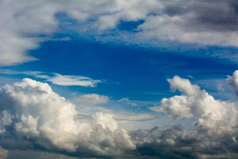 Sky and embossed clouds Stock Photos