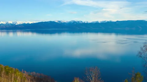 Sky and mountains reflected in the lake Stock Footage 63302312