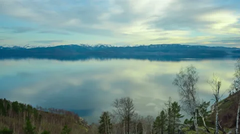 Sky and mountains reflected in the lake Stock Footage 63302380