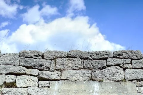 Sky and Stone wall background. Many stones Stock Photos