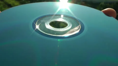 Sky and sun reflection from a smooth surface of the laser disk DVD Vidéo 11818150