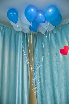 Sky and white balloons float on the white ceiling in the room for the party. Sky Stock Photos