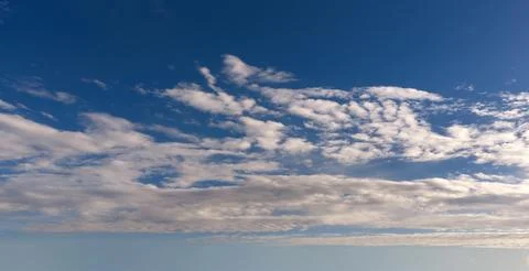 Sky background with cloud texture. Blue sky soft white clouds. Bright sky wal Stock Photos