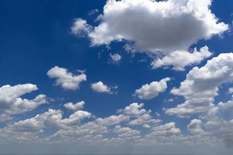 Sky background with cumulus clouds. Blue sky holds white clouds. Sunny sky cr 写真素材