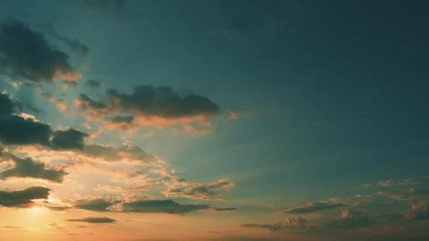 Sky Background Or Texture At Sunset Time With Clouds. Panoramic Sunset Sky With Stock-Fotos