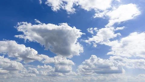 Sky background with sunny clouds. Blue sky frames white clouds. Summer sky .. Stock Photos