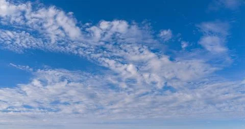 Sky background texture with clouds in blue. Bright sky soft white cloud tex.. Stock Photos