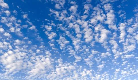 Sky background with texture clouds in blue. Bright sky soft white cloud tex.. Stock-Fotos