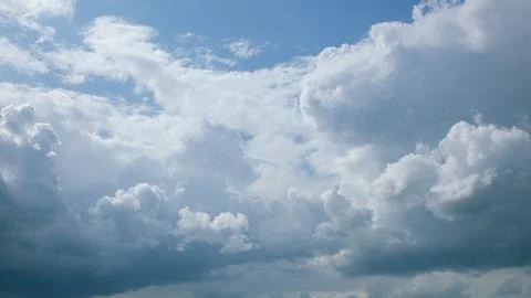 The sky is a beautiful canvas with dramatic cloud patterns that captivate observ 스톡 사진