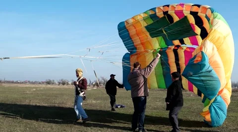 Sky Beginner parachutist falls to the ground with a parachute Stock Footage 59188288