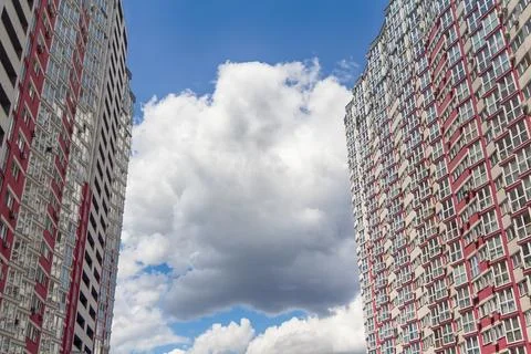 The sky between high multi-story houses Stock Photos