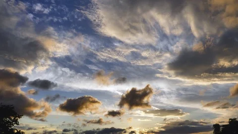Sky with blue and gold clouds at sunset Stock Footage 106675256