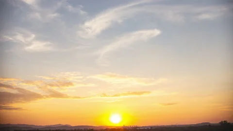 Sky blue and orange light of the sun through the clouds in the sky Stock Footage 144931822