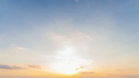 Sky blue and orange light of the sun through the clouds in the sky Stock Footage 144933772