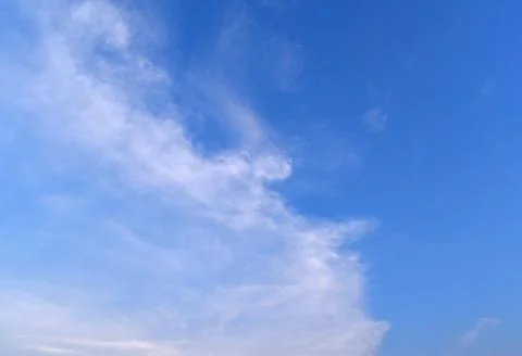 Sky blue background. Natural background.The sky with clouds and sunlight Foto stock