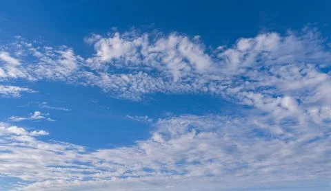 Sky blue clouds background in texture. Soft white sky cloud texture on backdrop Stock Photos