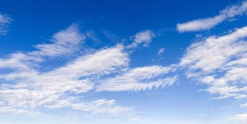 Sky blue clouds texture. Bright sky soft backdrop. Daytime sky wallpaper pattern 写真素材