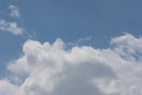 Sky blue daytime with floating clouds Stock Photos