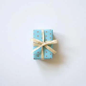 Sky blue dot pattern gift box isolated on white background Stock Photos