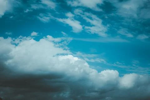 The sky is blue with a few clouds scattered throughout Stock-Fotos