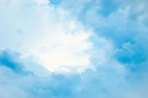 Sky-blue light fluffy clouds in sky Stock Photos