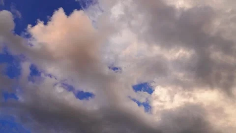 The sky is blue with several scattered clouds turning dark Stock-Footage 304182603