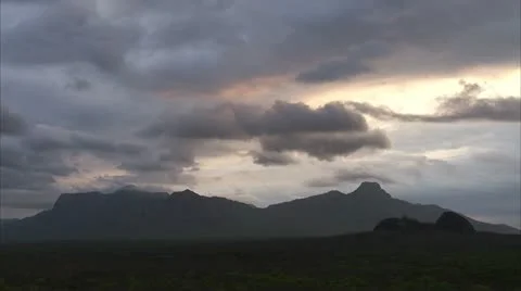 Sky breaking open over mountain in Niassa Reserve, Mozambique. Stock Footage 23749047