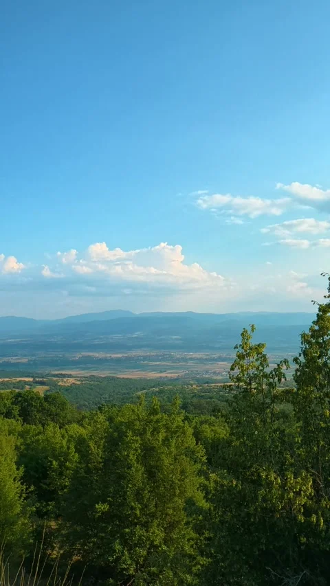 Sky brightens over distant hills. Pirot City, Vertical Vídeo Stock 341968106