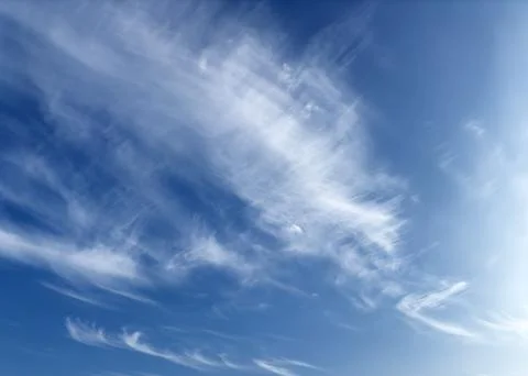 Sky with cirrus cloud. Wispy white pattern in blue atmosphere, soft and airy Stock Photos