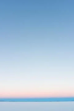 The sky is clear blue with fluffy white clouds Stock Photos