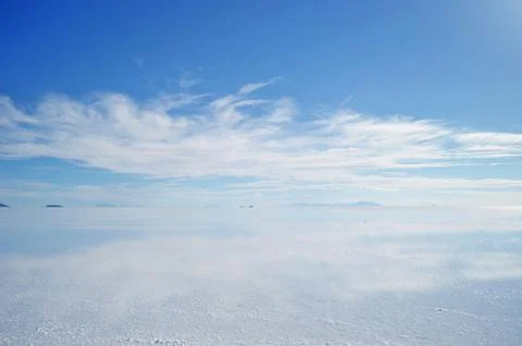 The sky is clear blue with fluffy white clouds Stock Photos