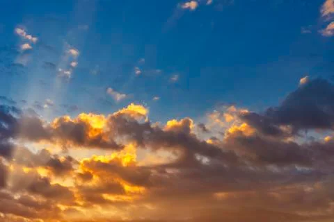 Sky with cloud and sun ray yellow and blue color background. With copy space  Stock Photos