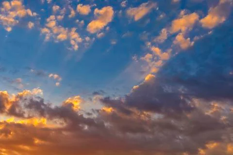 Sky with cloud and sun ray yellow and blue color background. With copy space  Stock Photos