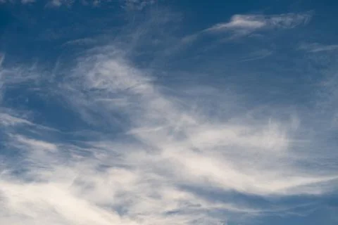 Sky cloud flow. Moving clouds under blue sky. Soft clouds drift across brig.. Stock Photos