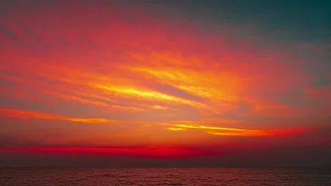 Sky with clouds above the ocean at colorful sunset 4K Time-lapse Stock Footage 293147335