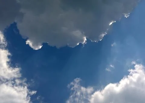 Sky with clouds and barely visible sunlight Stock Photos