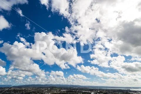 Sky clouds and city Stock Photos