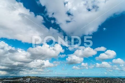 Sky clouds and city Stock Photos