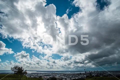 Sky clouds and city Stock Photos