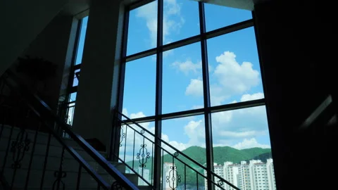 The sky, the clouds, and the mountains and the apartments Stock Footage 94011578