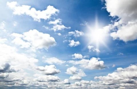 Sky with clouds and sun Stock Photos